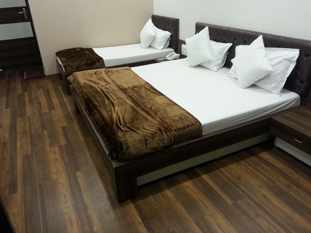 Hotel Oasis Мумбаї Номер фото