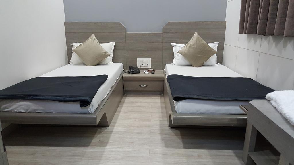 Hotel Oasis Мумбаї Номер фото